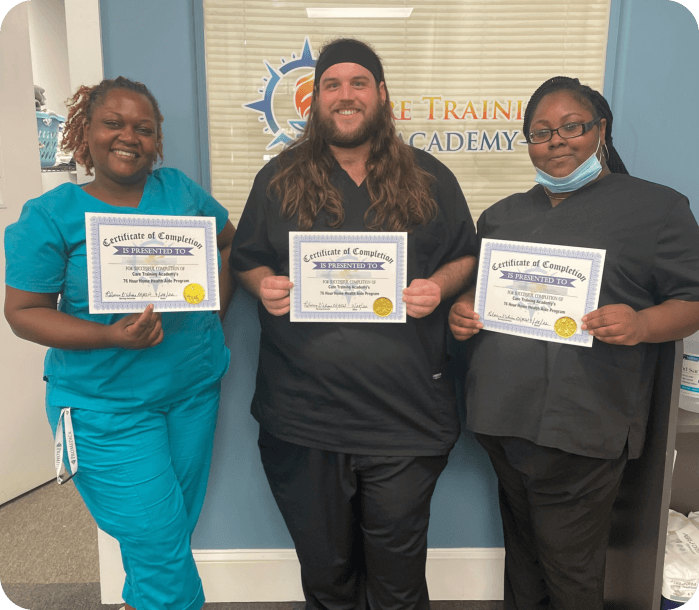 Three medical staffs smiling while holding certificates