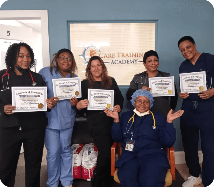 Six medical staffs smiling while the five of them are holding certificates