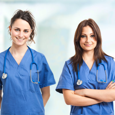 Two female nurse smiling together