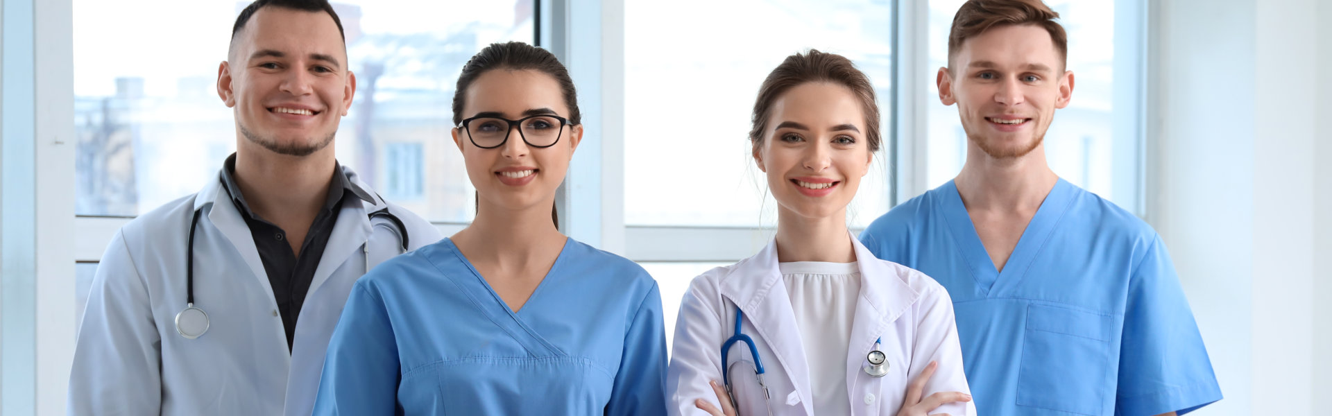 Four medical staffs smiling together