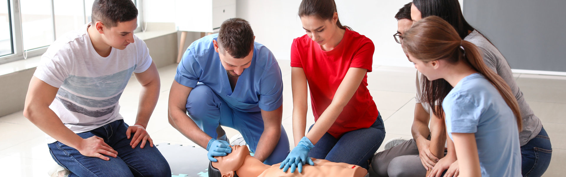 group of people practicing cpr