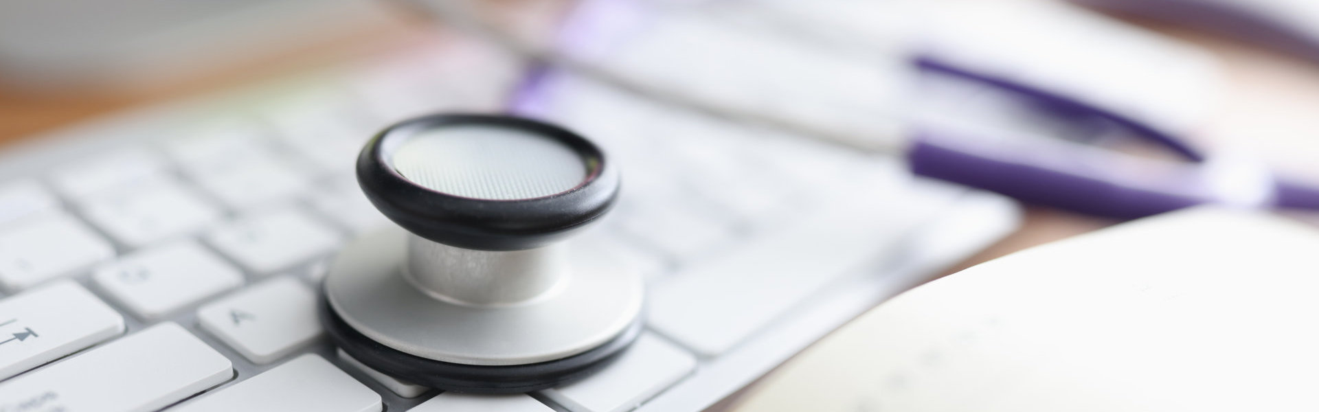 A stethoscope on top of a keyboard